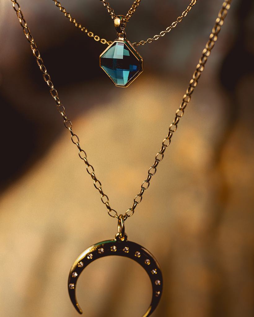 Chandrika crescent pendant on a gold-plated chain