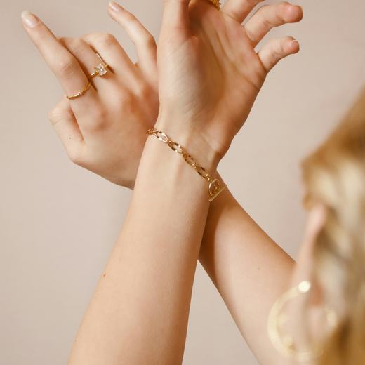 Stacked Aurelia bracelets worn on both wrists